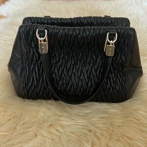 Black COACH Madison gathered twist mini satchel with crossbody strap.
